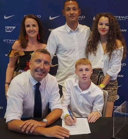 Young Cole Palmer when he signed his first contract